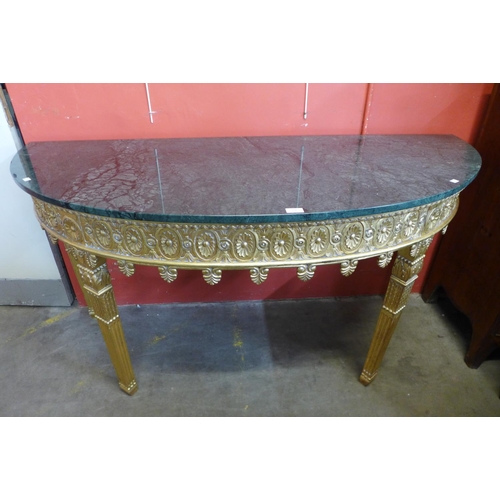 76 - A French style giltwood and marble topped demi-lune console table, 86cms h, 164cms w, 86cms h