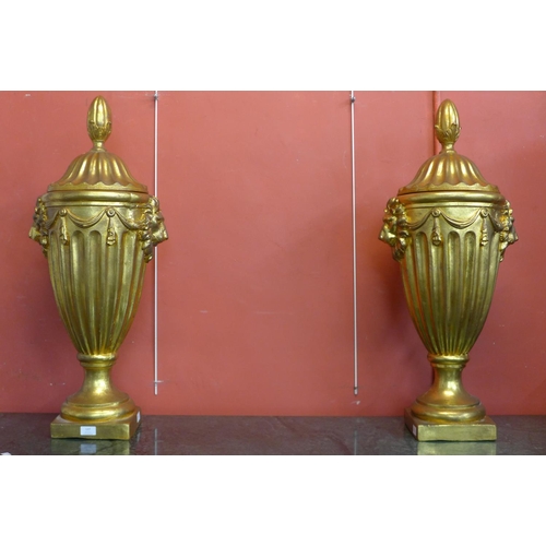 81 - A pair of large George III style gilt urns and covers, 88cms h (20038898)   #