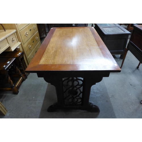 239 - A Victorian Gothic Revival oak library table (later top), 72cms h ,116cms w, 69cms d