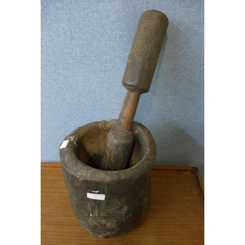 378 - A carved hardwood pestle and mortar, possibly Native American, 56cm