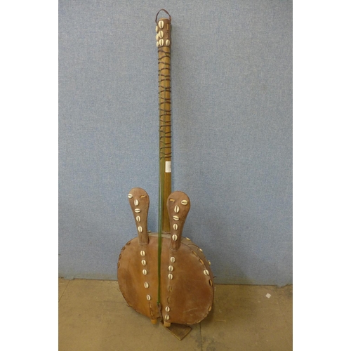 407 - An African animal hide guitar