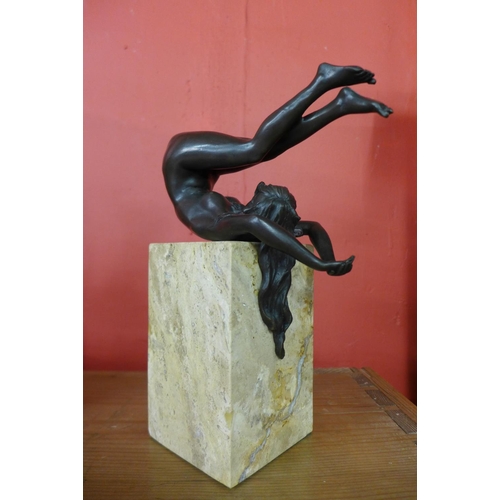 423 - An erotic female bronze sculpture on marble base, 27cms h.