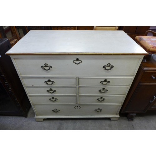 304 - A George III painted oak chest of drawers (top adapted to lift up)