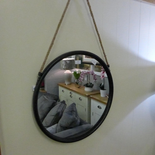 1463 - A circular black framed mirror with rope hanger, 58cms, (JRG1714)   #