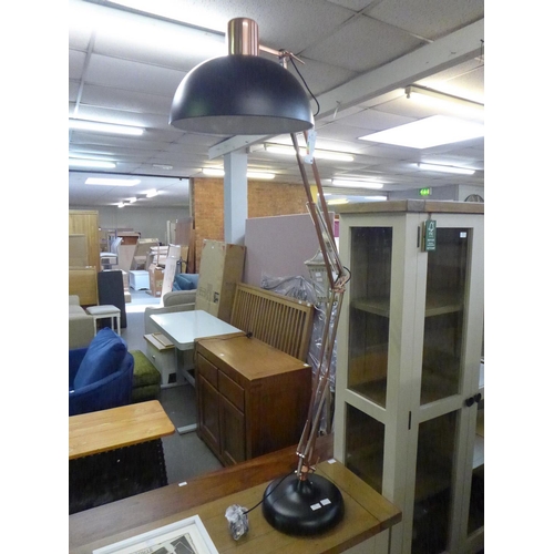 1464 - A black and copper floor lamp * This lot is subject to VAT