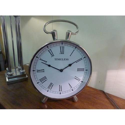 1512 - A circular chrome table clock with loop handle (1754225)   #