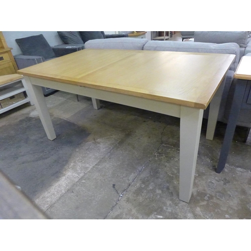 1543 - An oak and truffle extending dining table  *This lot is subject to VAT