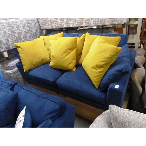 1551 - A deep blue velvet three seater sofa Some marks.