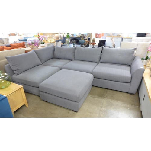 1502 - A grey upholstered corner sofa, with pouffe