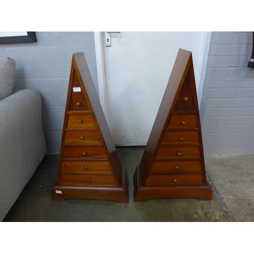 1545 - A pair of triangular Indonesian hardwood five drawer chests