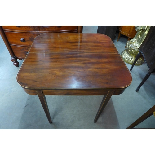 101 - A George III inlaid mahogany D-shaped fold over tea table