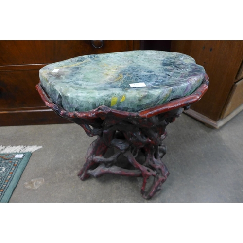 110 - A Chinese naturalistic root wood and green hardstone table