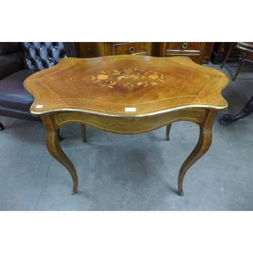 112 - A French Louis XV style inlaid rosewood and gilt metal mounted serpentine centre table