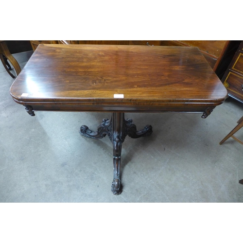 113 - An early Victorian rosewood D-shaped fold over tea table