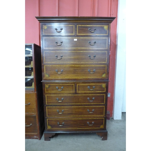 116 - A George III style inlaid mahogany chest on chest