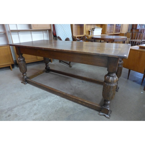 119 - A 17th Century style carved oak refectory table