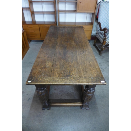 119 - A 17th Century style carved oak refectory table