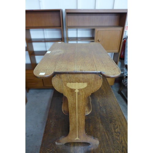 120 - An Arts and Crafts inlaid oak occasional table, attributed to Liberty & Co.