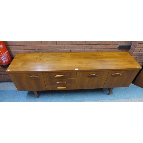 125 - A teak sideboard