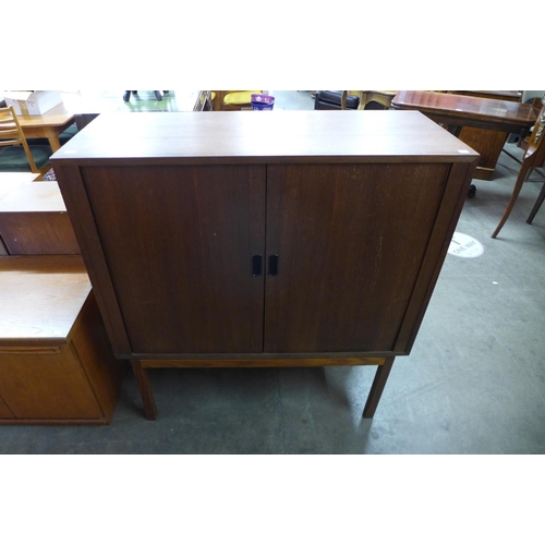 151 - A Danish teak tambour front two door cabinet