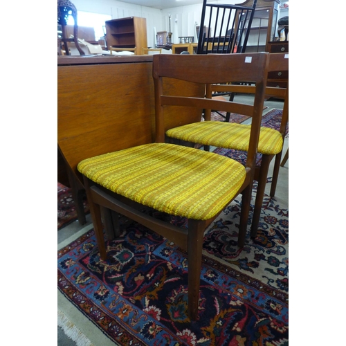 156 - A Nathan teak drop leaf table and four chairs