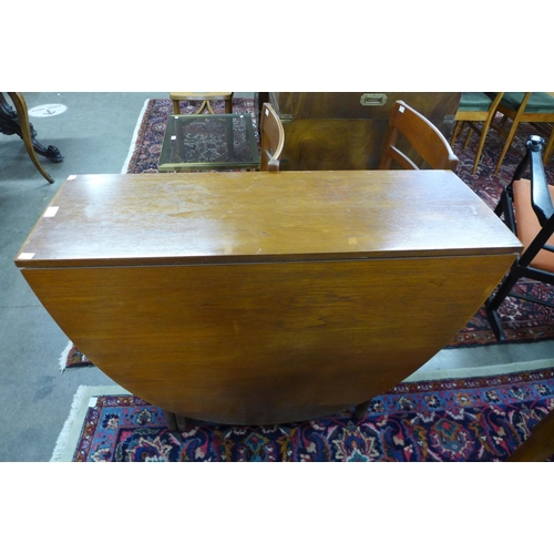 156 - A Nathan teak drop leaf table and four chairs