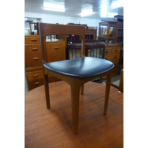 161 - A Nathan teak extending dining table and four chairs