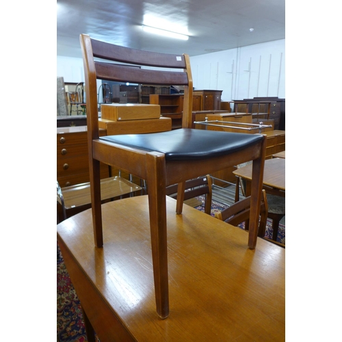 173 - A teak drop leaf table and four chairs