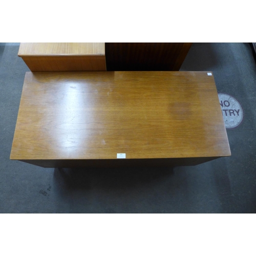 181 - A teak ottoman and two teak coffee tables