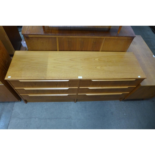 182 - A teak chest of drawers