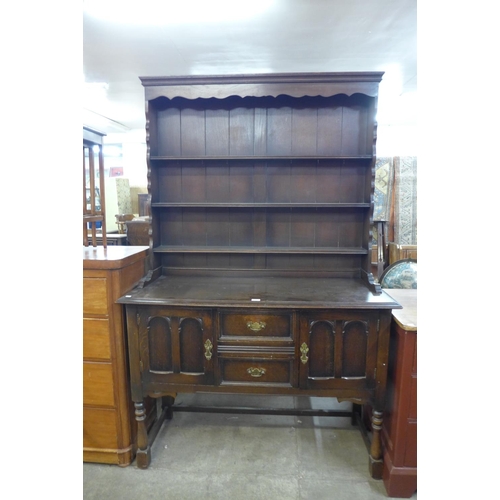 220 - A carved oak dresser