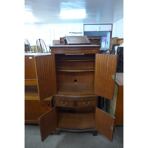 224 - A mahogany and burr walnut serpentine side cabinet