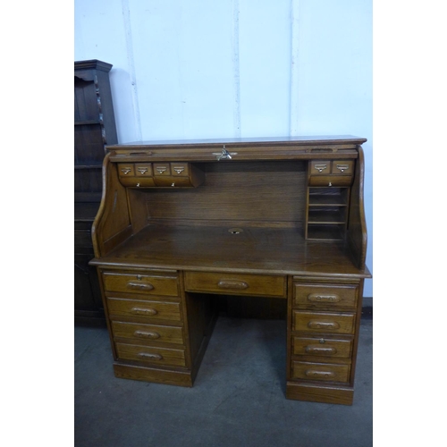 225 - An oak tambour roll top Country Desk