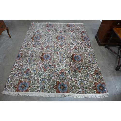 273a - A large beige ground rug