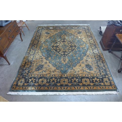 273b - A large turquoise ground rug, 360 x 280cms