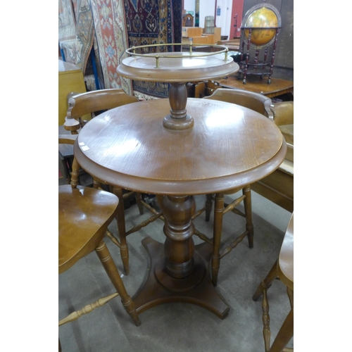 283 - An oak pub table and four beech stools