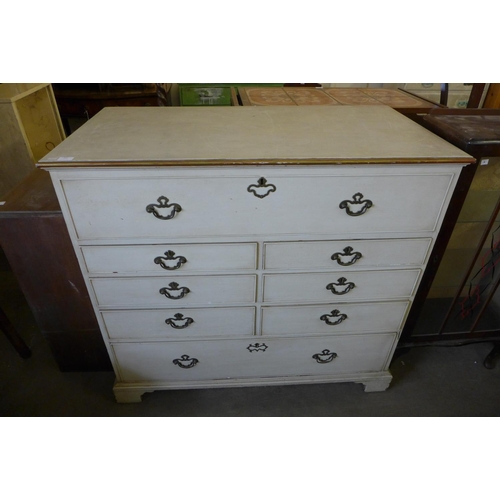 304 - A George III painted oak chest of drawers (top adapted to lift up)