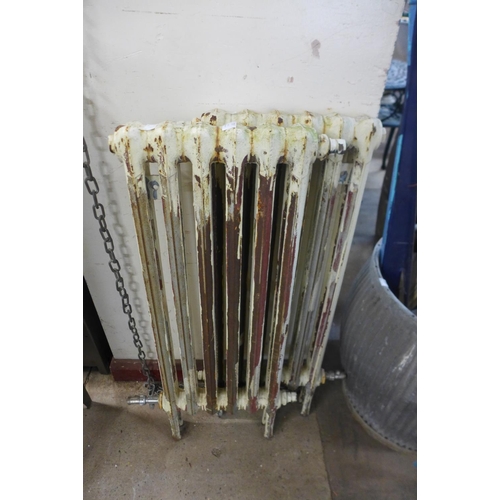 370 - Two small cast iron radiators