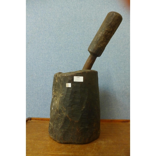 378 - A carved hardwood pestle and mortar, possibly Native American, 56cm