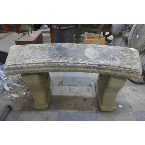 384 - A concrete pedestal garden bench