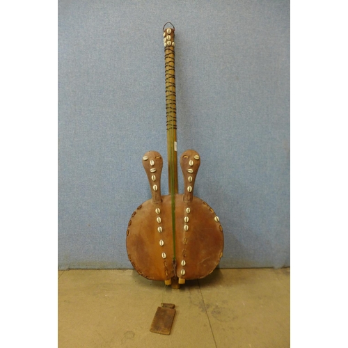 407 - An African animal hide guitar