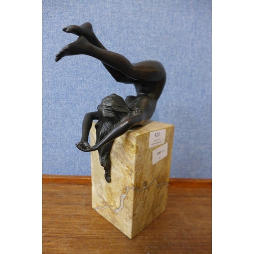 423 - An erotic female bronze sculpture on marble base, 27cms h.