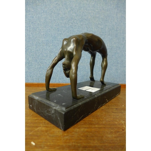 424 - An erotic female bronze sculpture on marble base, 17cms h.