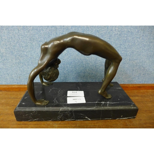 424 - An erotic female bronze sculpture on marble base, 17cms h.