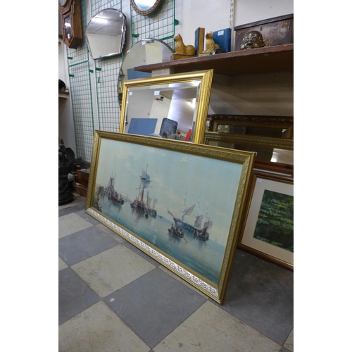 431 - A gilt framed mirror and a marine scene print