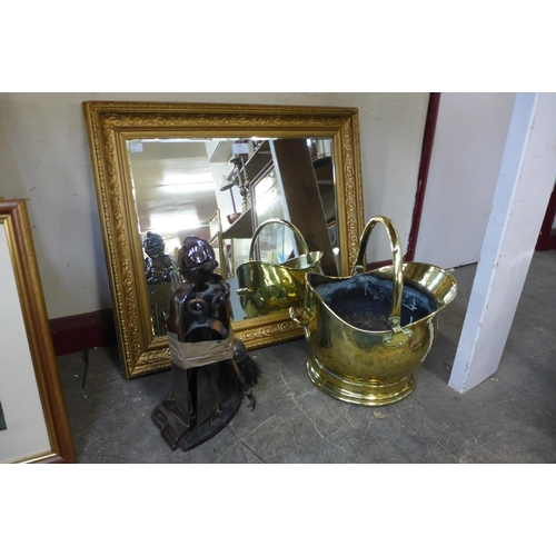 432 - A gilt framed mirror, brass coal bucket and a companion set