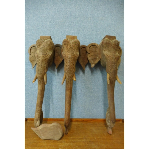 433 - Three Indian carved elephant table legs, tusks a/f