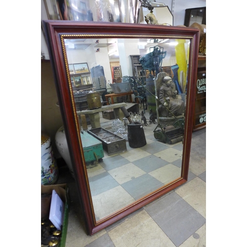 440 - A mahogany and parcel gilt framed mirror