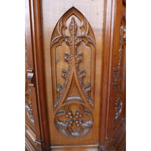 70 - A Victorian Gothic Revival carved oak church pulpit, 186cms h, 116cms w.