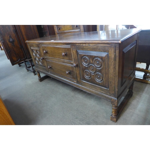 71 - A 17th Century style carved oak dresser